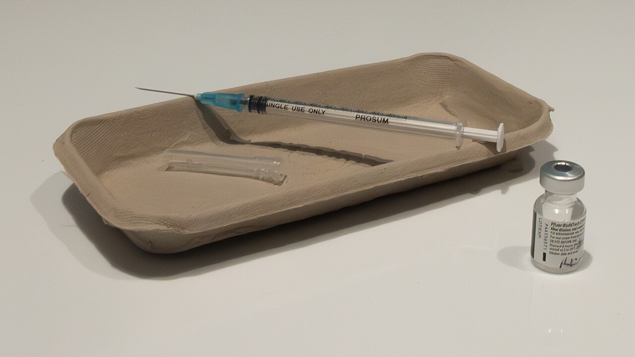 Vial and syringe used for the first COVID-19 vaccination in the world (outside of trials). This first Pfizer–BioNTech vaccine was given to 90-year-old