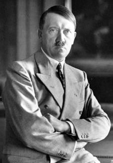 Obersalzberg, Berghof, Adolf Hitler in office sitting on his desk. Bavarian national library, Hoffmann phototheque, image number hoff-1956. Picture of