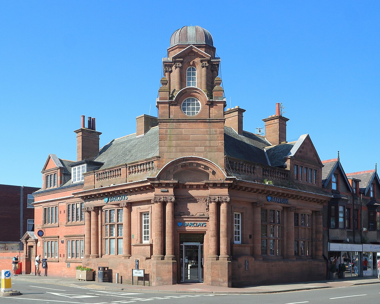 Grade II listed bank building in West Kirby Merseyside. Early C20, Free Baroque style in ashlar sandstone. Formerly a Bank of Liverpool branch.