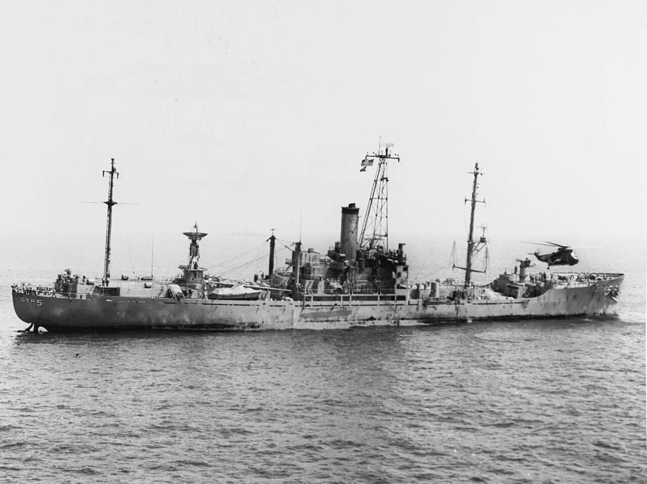 The U.S. Navy electronic reconnaissance gathering ship USS Liberty (AGTR-5) receives assistance from units of the U.S. Sixth Fleet, after she was atta